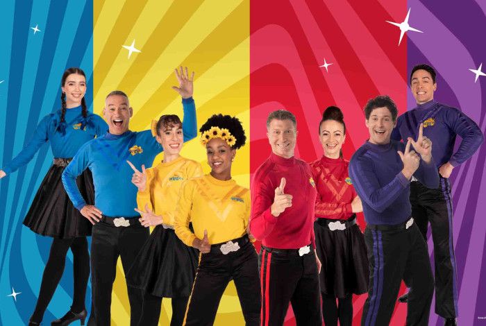 The Wiggles, against multi-coloured background