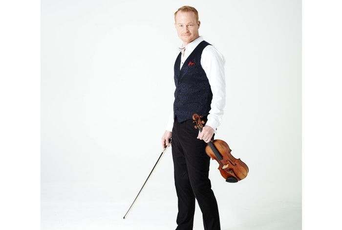 Man standing with a violin