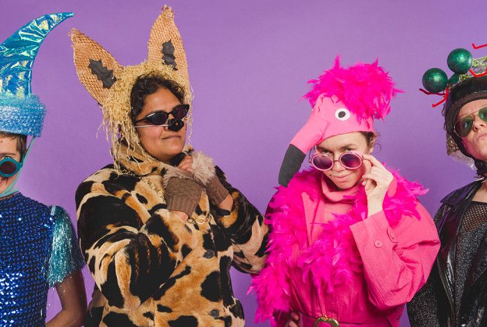 Four people dressed in customes