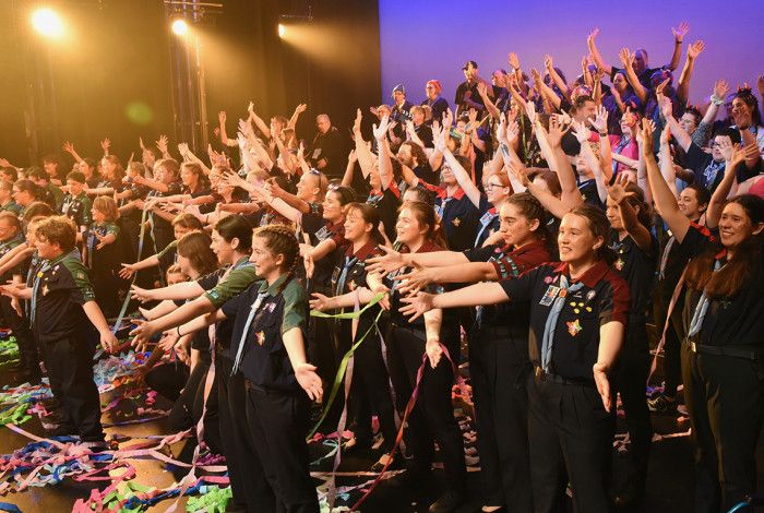 Lots of children on stage after a performance