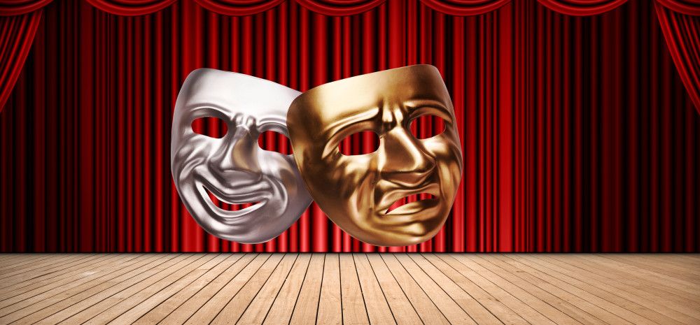 Drama masks - one smiling, one frowning, in silver and gold against a stage background with a red curtain