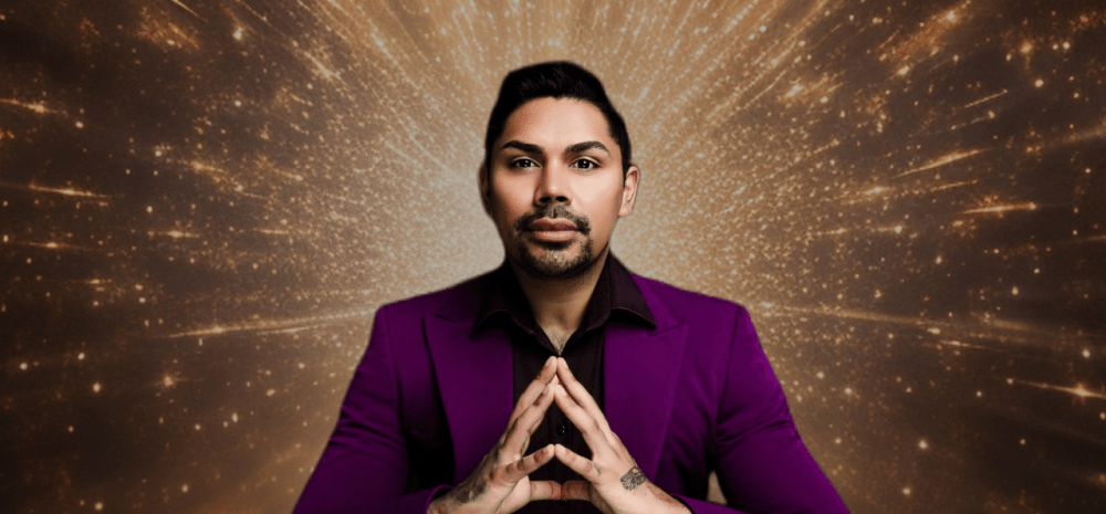 Cael O'Donnell, dressed in purple jacket, with his fingertips pressed together, against a cosmic brown-gold background