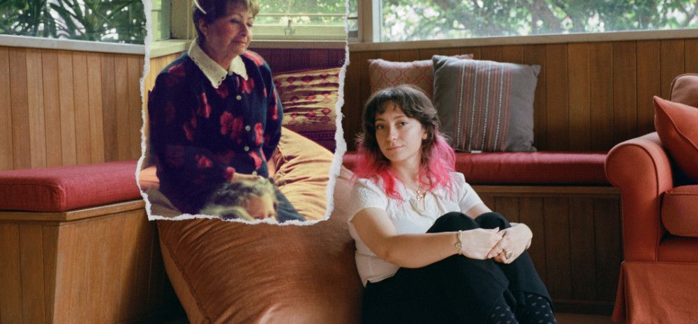Two ladies sitting down