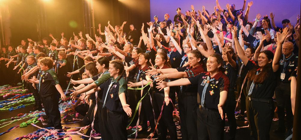 Lots of children on stage after a performance