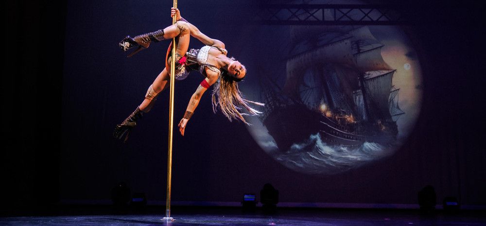A lady performing on a pole