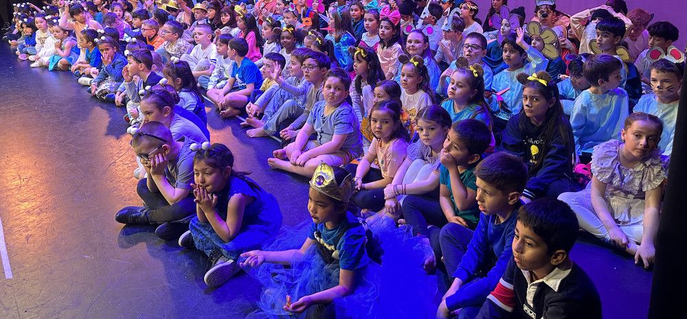 Students sitting on the floor