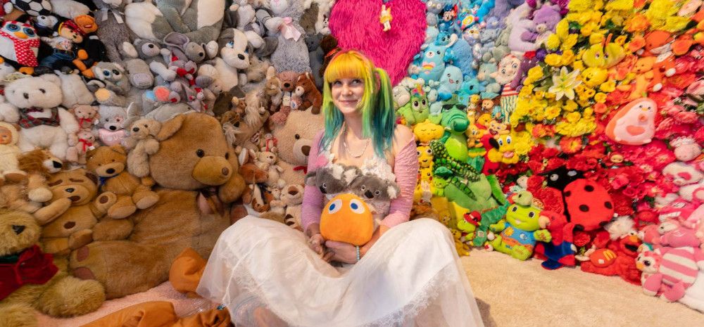 Moon Girle surrounded by toys.