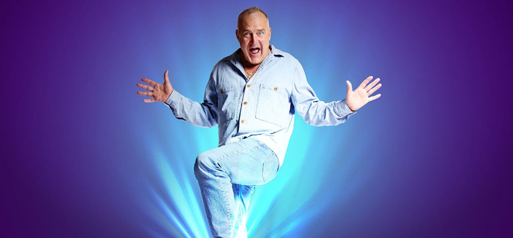 A man jumping with his hands out