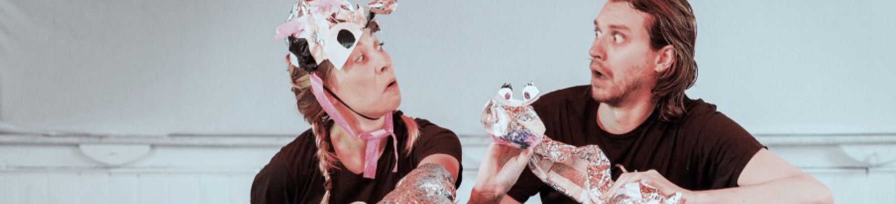 Two people with puppets