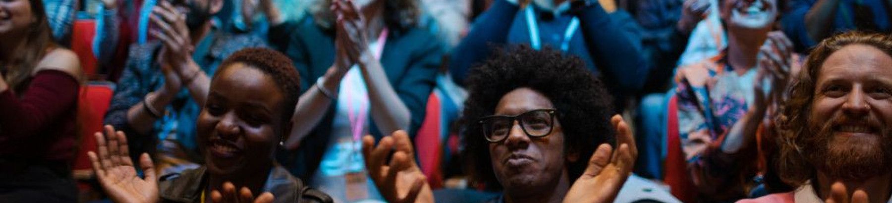 People clapping at a performance